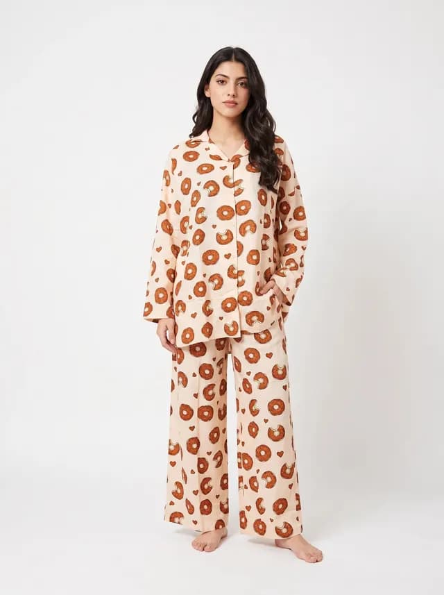 Woman wearing a cream donut print full sleeve linen PJ set